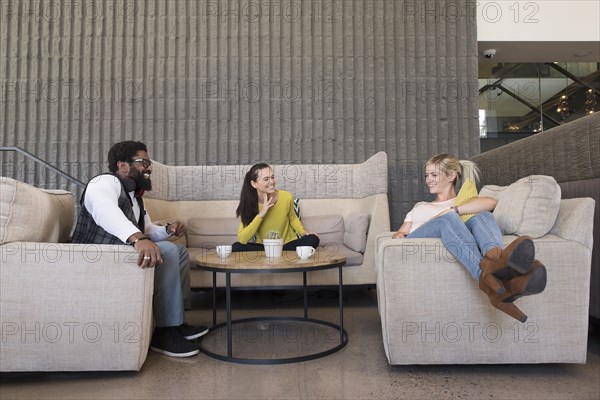 Friends hanging out in lounge