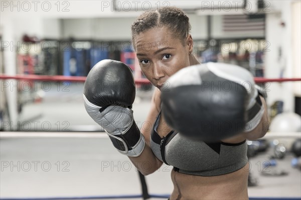 Black woman posing in boxing ring