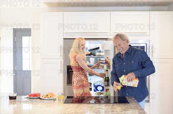 Caucasian couple in kitchen