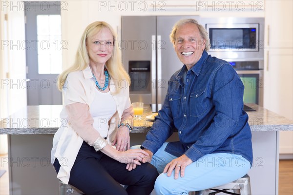 Portrait of smiling Caucasian couple in kitchen