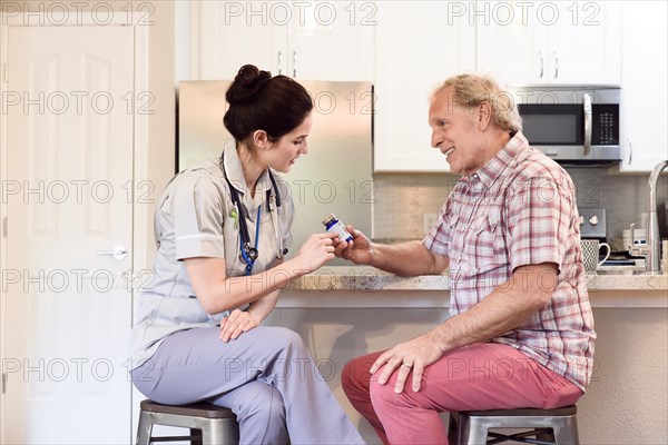 Caucasian nurse explaining prescription to man