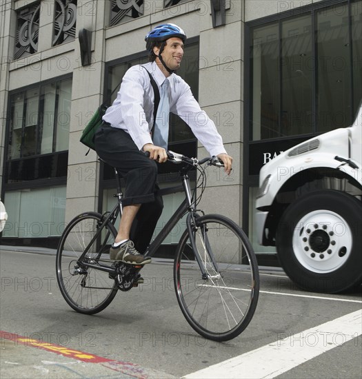 Businessman commuting on bike