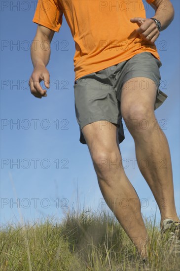 Man walking through grass