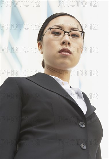 Low angle view of Asian businesswoman outdoors