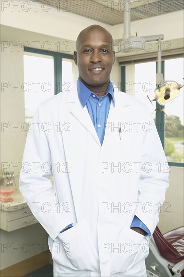 African male dentist in office