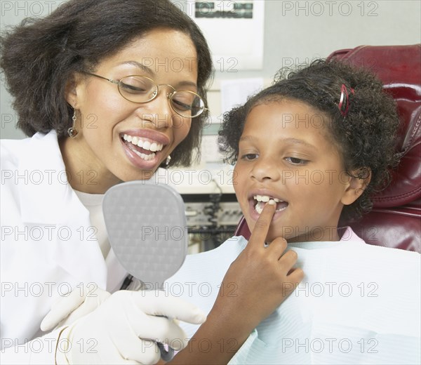 African female dentist young female patient