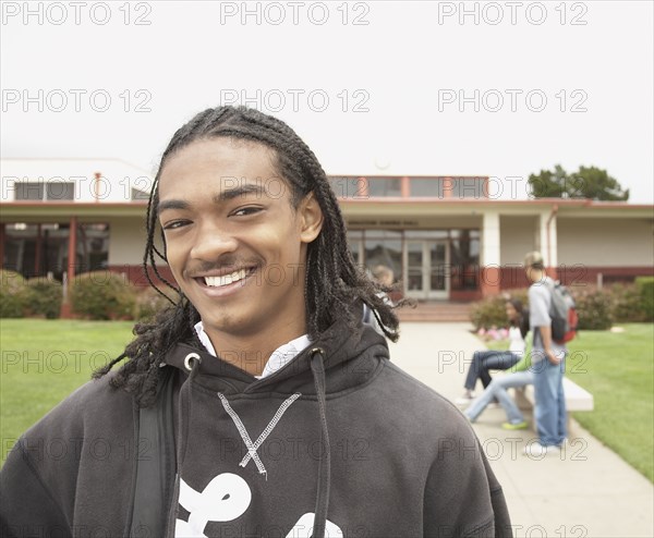 Young African man smiling on school campus