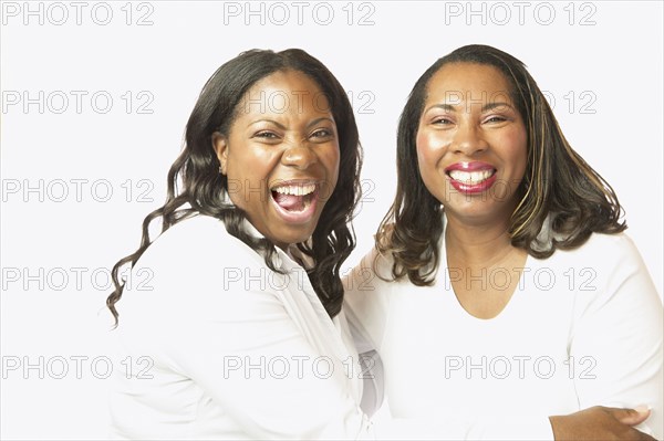 Adult African sisters laughing