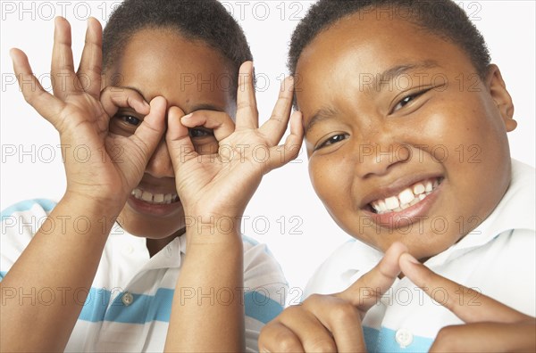 Young African twin brothers being silly