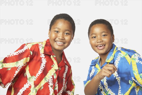 Young African twin brothers smiling