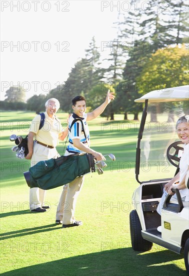Asian family on golf course