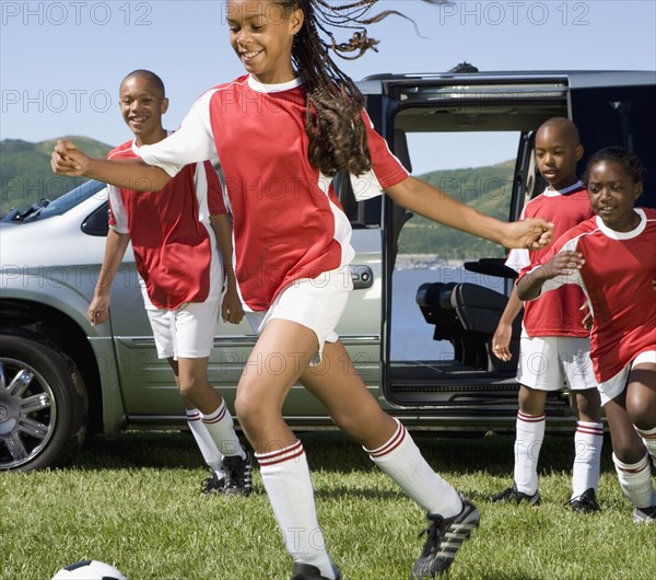 Multi-ethnic children in soccer uniforms