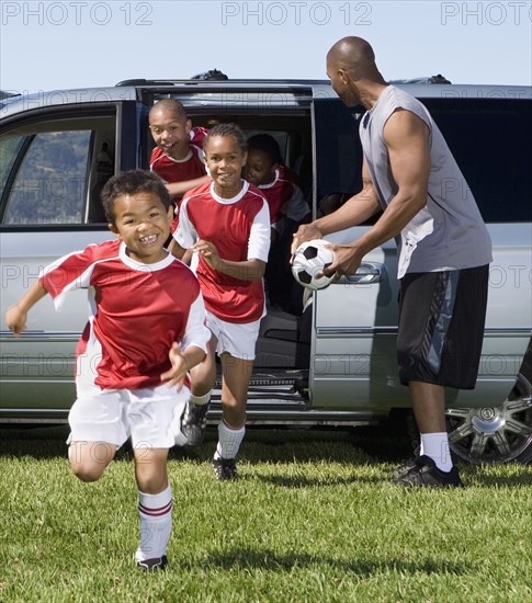 Multi-ethnic children in soccer uniforms