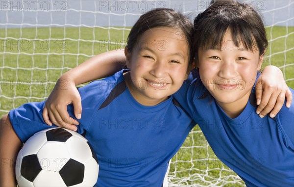 Multi-ethnic girls with soccer ball