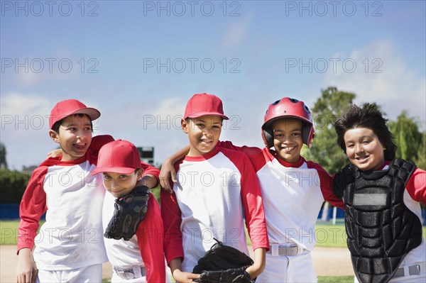 Multi-ethnic boys in baseball uniforms