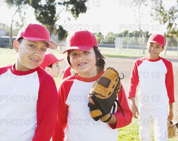 Multi-ethnic boys in baseball uniforms