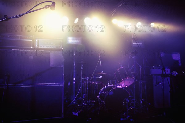 Drum kit on spotlighted stage