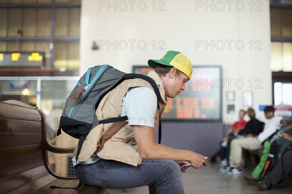 Caucasian man waiting in train station