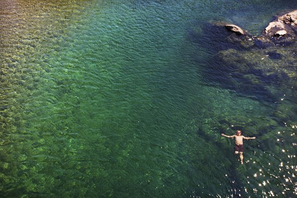 Caucasian man swimming in ocean