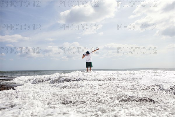 Man standing in ocean waves