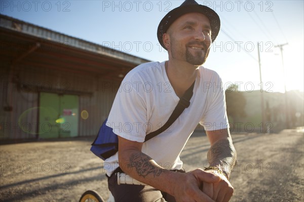 Bicycle messenger stopping on city street