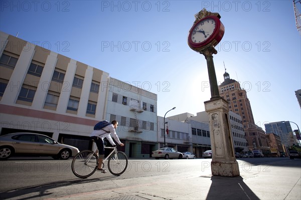 Bicycle messenger riding on city street