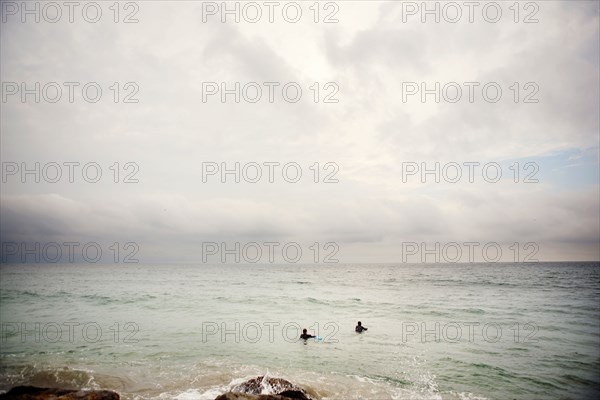 People swimming in ocean