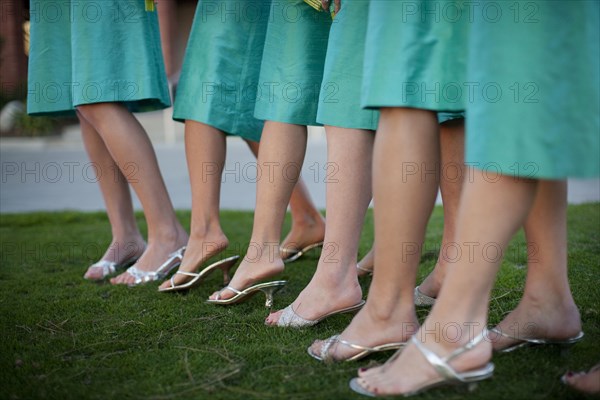 Bridesmaids legs in a row