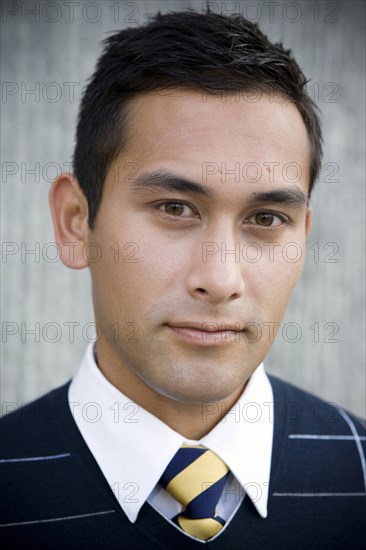 Serious mixed race businessman