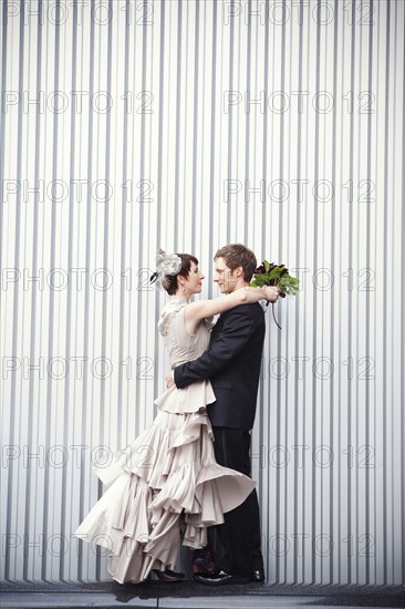 Bride and groom hugging