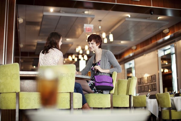 Caucasian women having lunch in diner