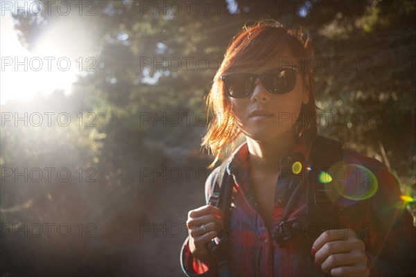 Korean woman in backpack and sunglasses