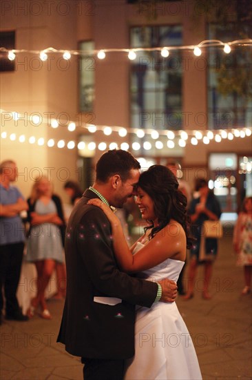 Bride and groom dancing at reception