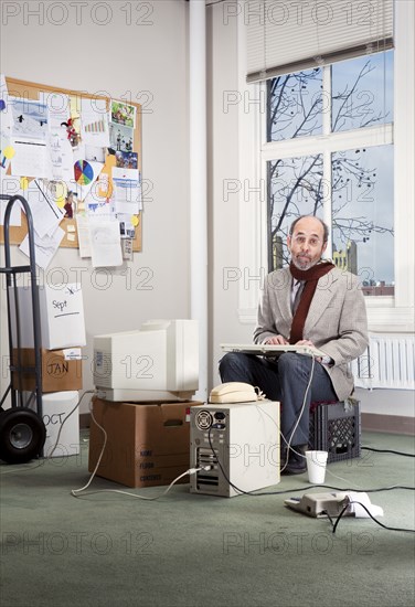 Caucasian businessman working in empty office