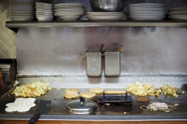 Breakfast cooking on diner griddle