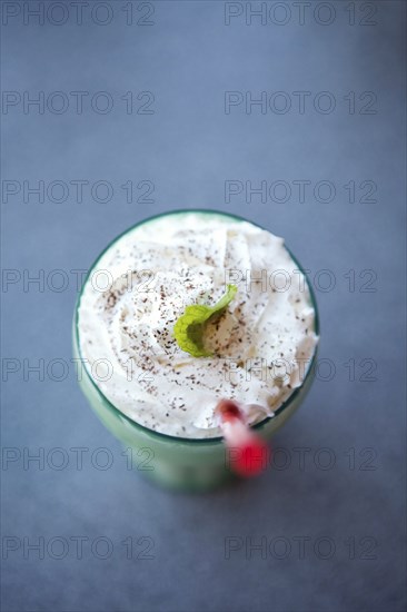 Milkshake and straw in glass