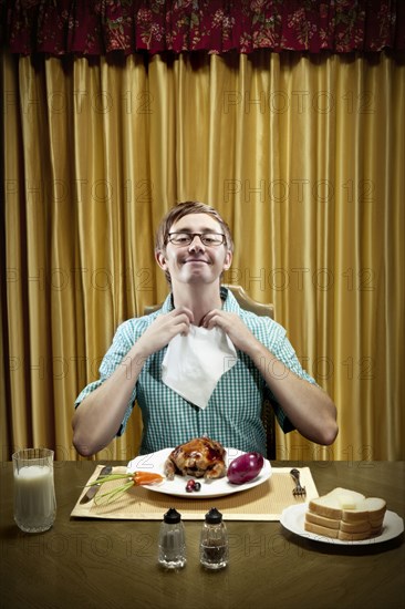 Caucasian man preparing to eat dinner