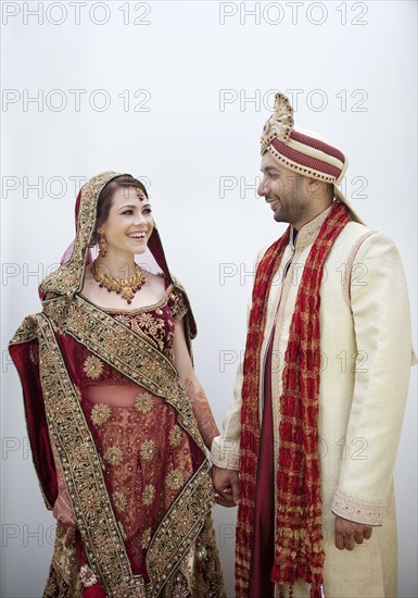 Bride and groom in traditional Indian wedding clothing