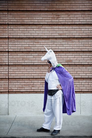 Caucasian man in unicorn costume