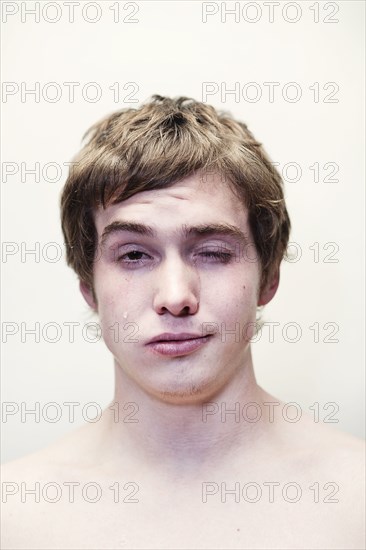 Caucasian young man crying