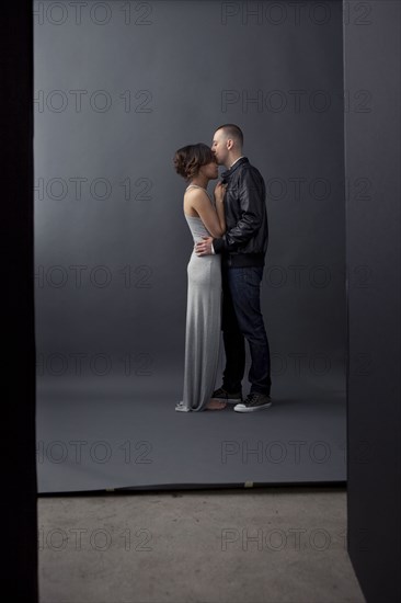 Couple kissing in studio