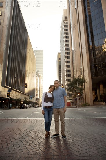 Couple standing on city street