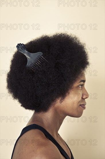 African American man wearing comb in afro hairstyle