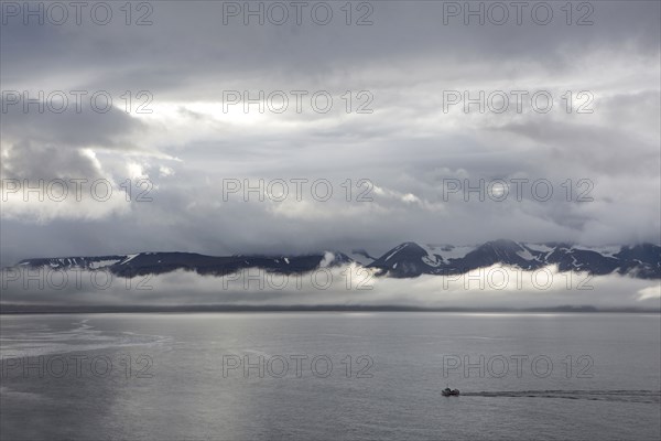 Aerial view of seascape and remote mountains