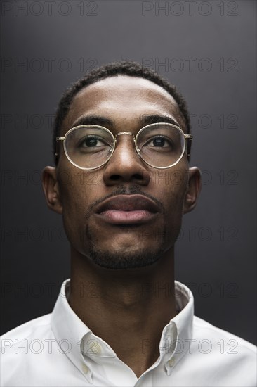 Portrait of serious Black man wearing eyeglasses