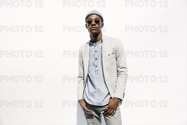 Portrait of serious Black man wearing sunglasses