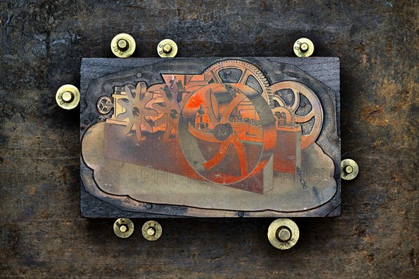 Close up of letter press wood block and gold weights