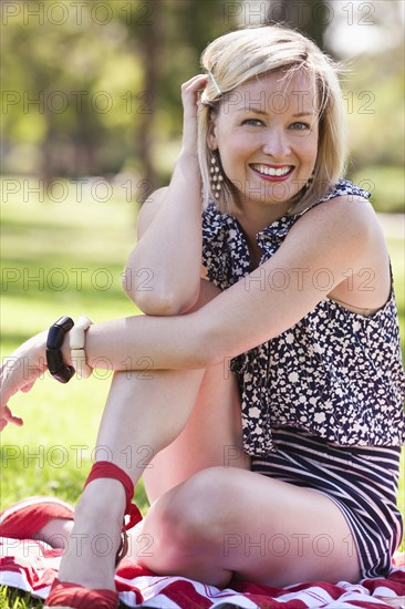 Caucasian woman smiling in grass