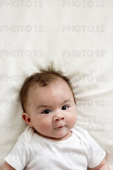 Close up of face of mixed race baby boy