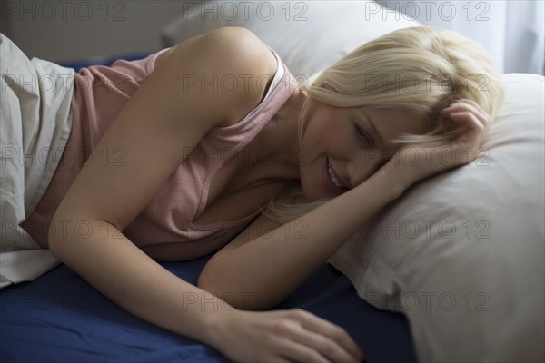 Caucasian woman laying in bed